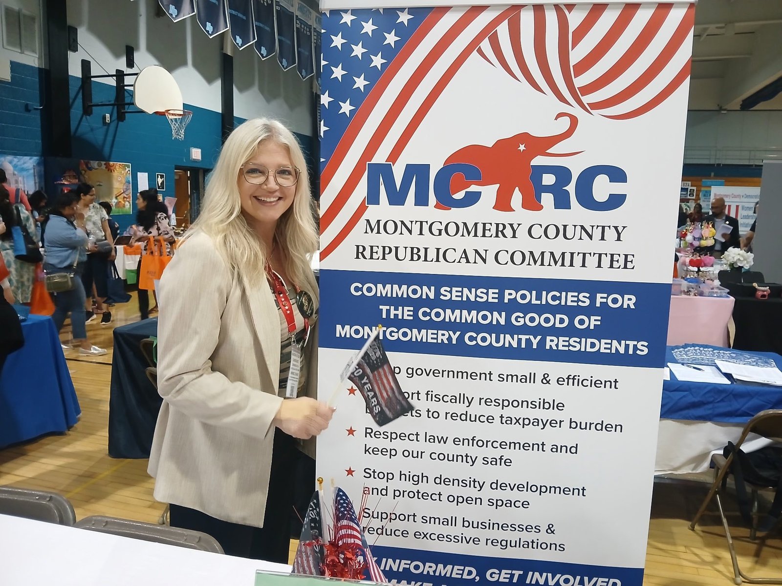 Aurora Stuski for Congress at Montgomery County Community event with banner promoting Common Sense Policies